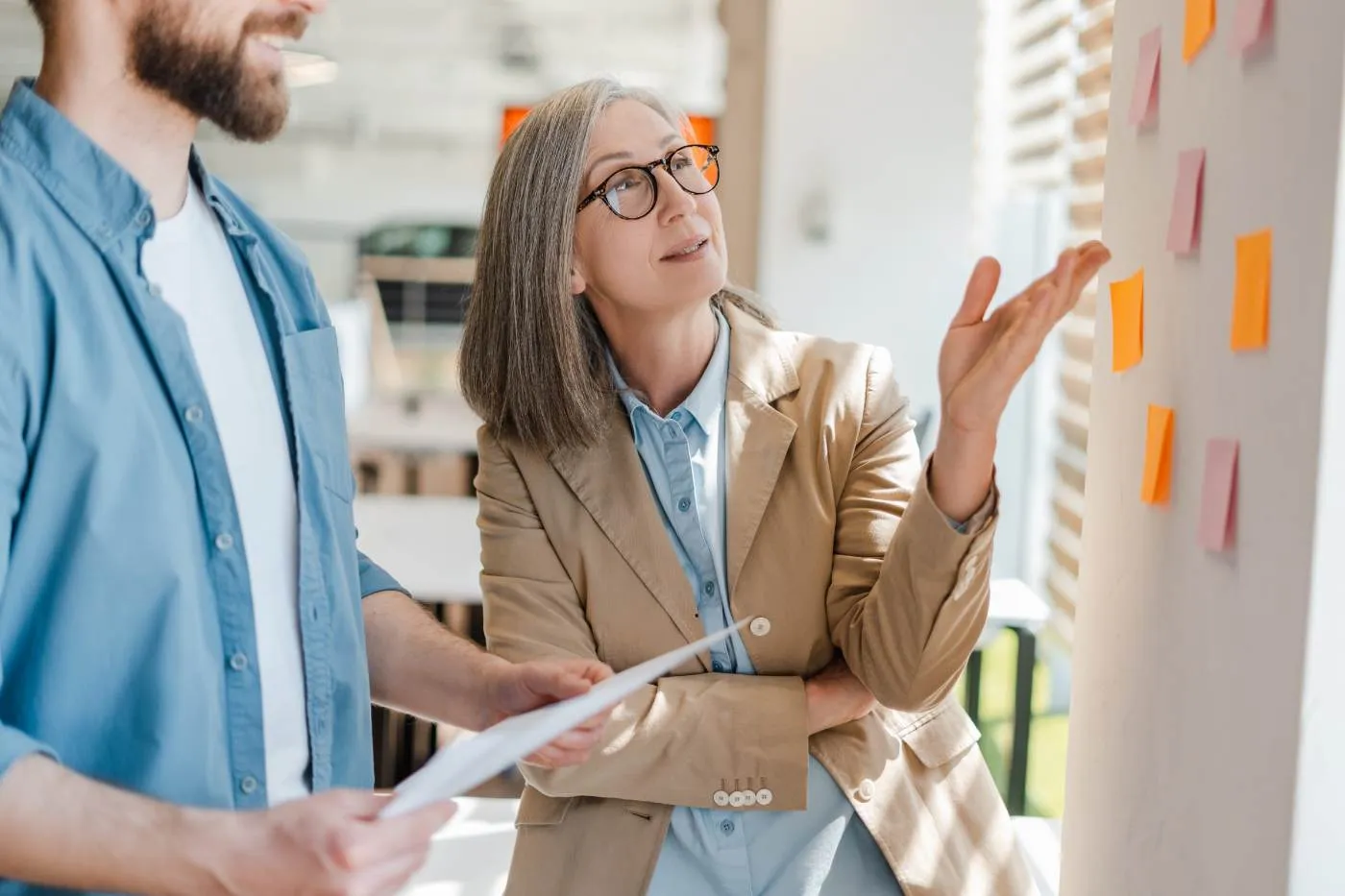 A facilitator gesturing mid-conversation in a workshop