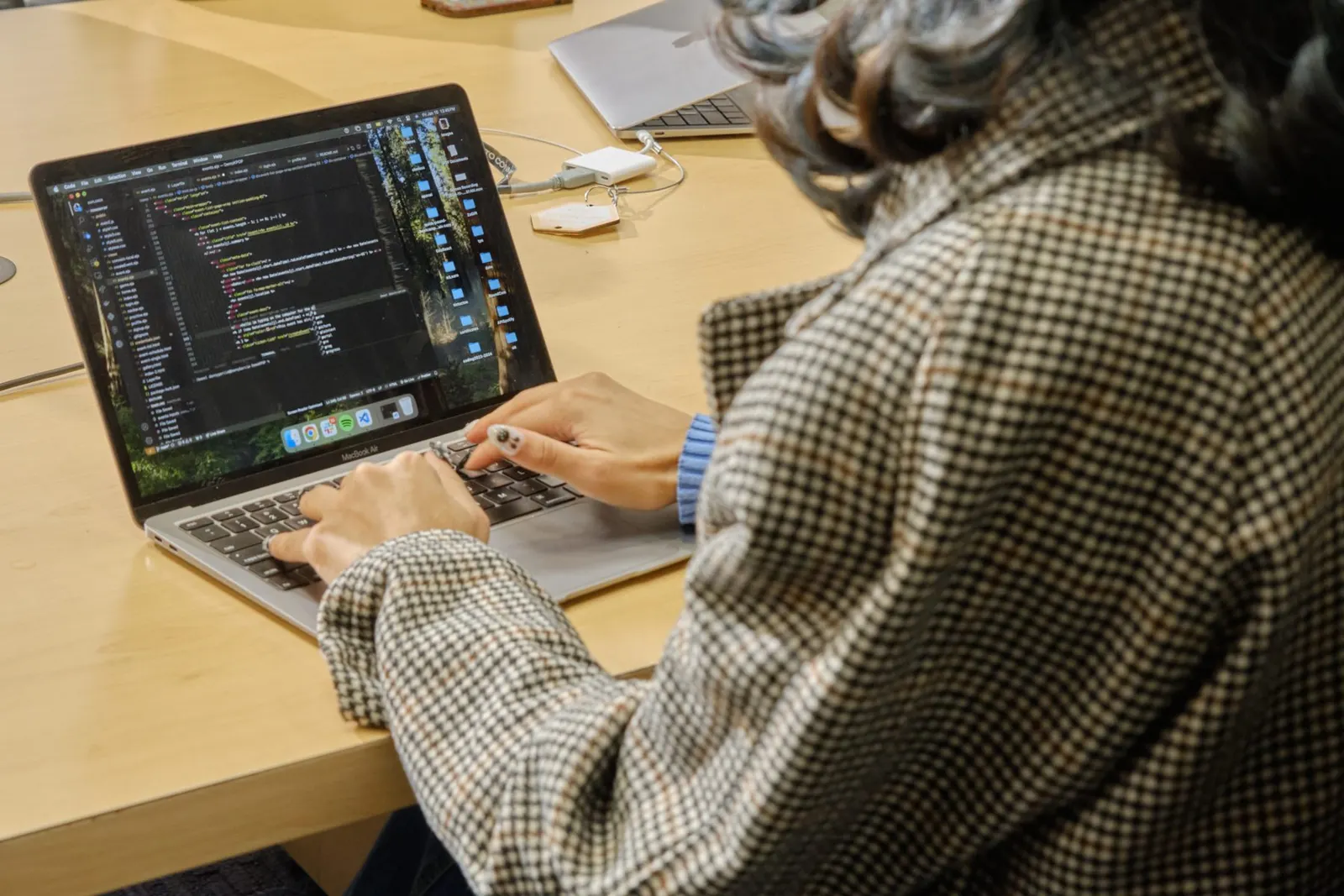 An engineer writing code on a laptop